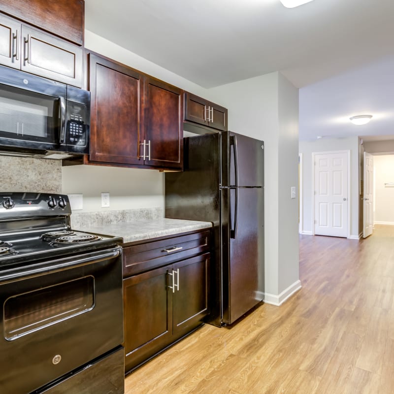 Model kitchen with wood cabinets at Centra Square in Charlotte, North Carolina