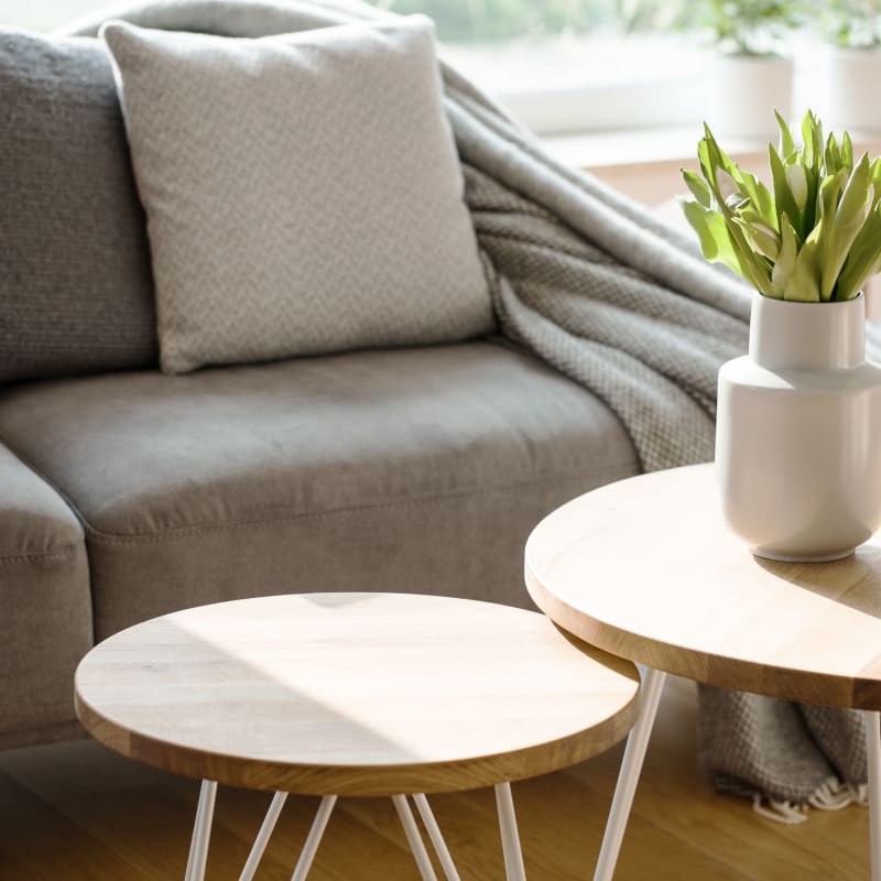 Gray couch with wood tables at Centra Square in Charlotte, North Carolina