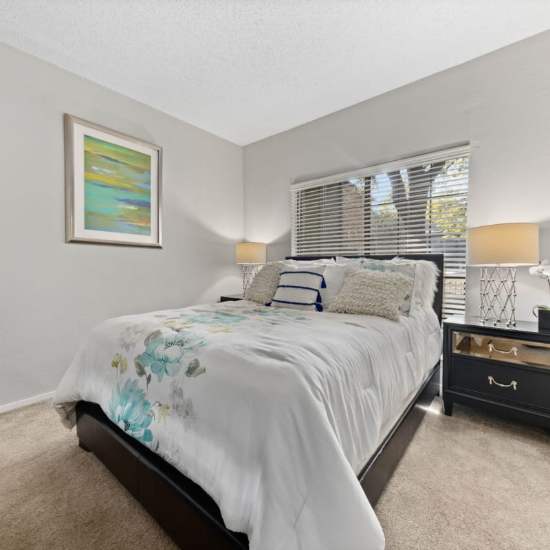 Bedroom with nice decor at Ronan Apartment Homes in Grand Prairie, Texas