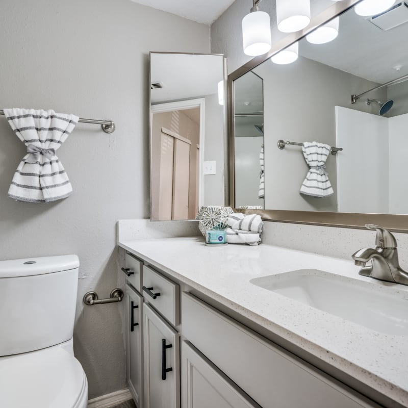 Bathroom with good lighting at Mateo Apartment Homes in Arlington, Texas