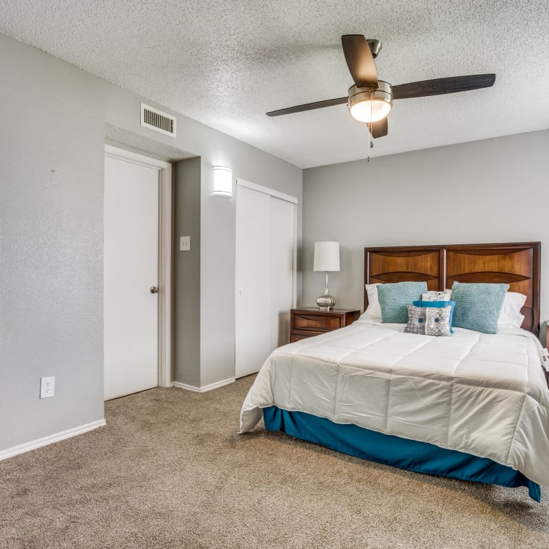 Bedroom with ceiling fan at Mateo Apartment Homes in Arlington, Texas