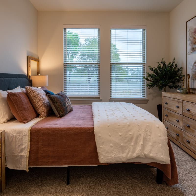 Bedroom with plush carpeting at The Preserve at Willow Park in Willow Park, Texas
