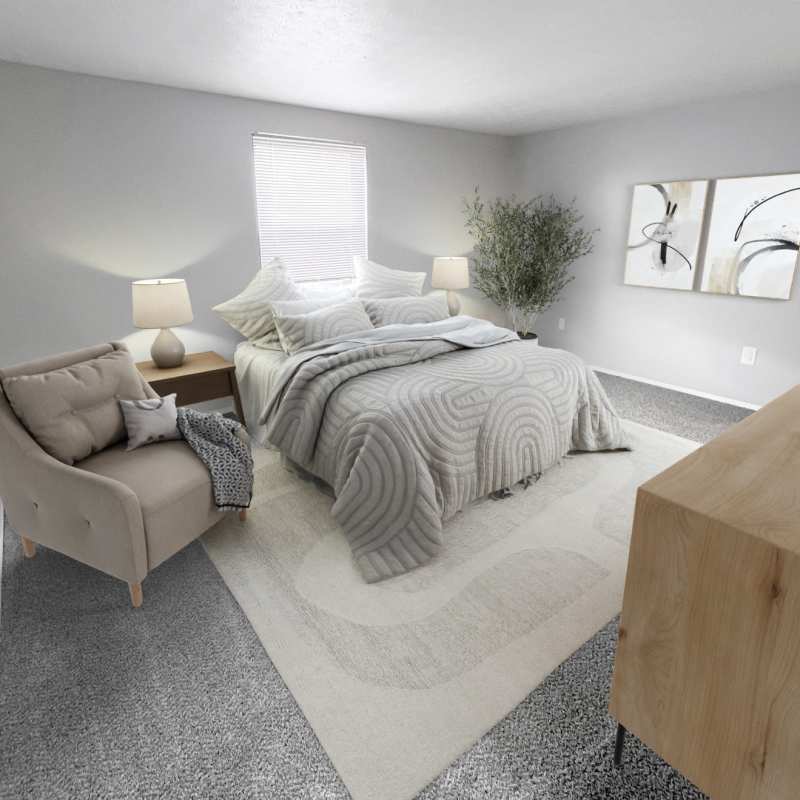 Spacious bedroom with a comfortable bed at North Eden Townhomes in Columbus, Ohio