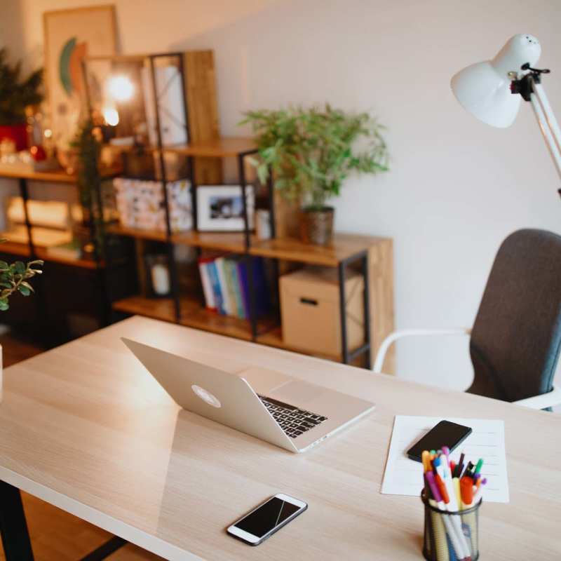 A work table with a laptop and a table lamp on it at Copper Mountain in Richland, Washington