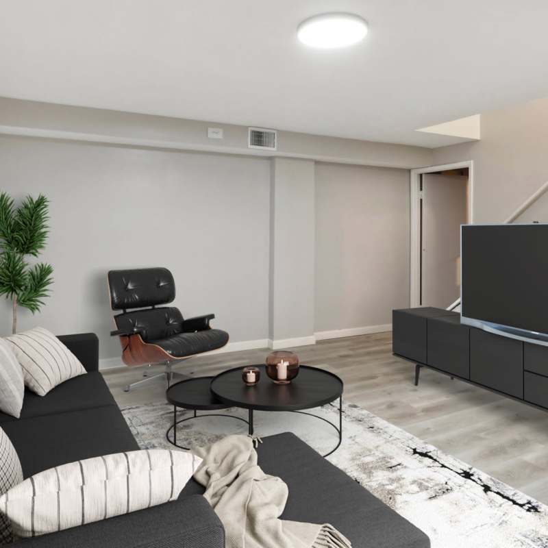 Spacious living room with a comfortable couch at North Eden Townhomes in Columbus, Ohio