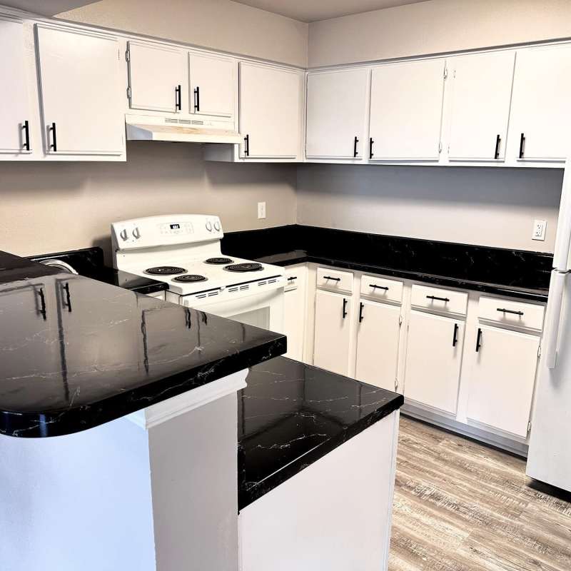 Kitchen with white color appliance at Steeplechase in Coweta, Oklahoma 