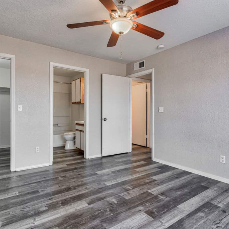 Bedroom with attached bathroom at Stonewall Apartments in Purcell,Oklahoma