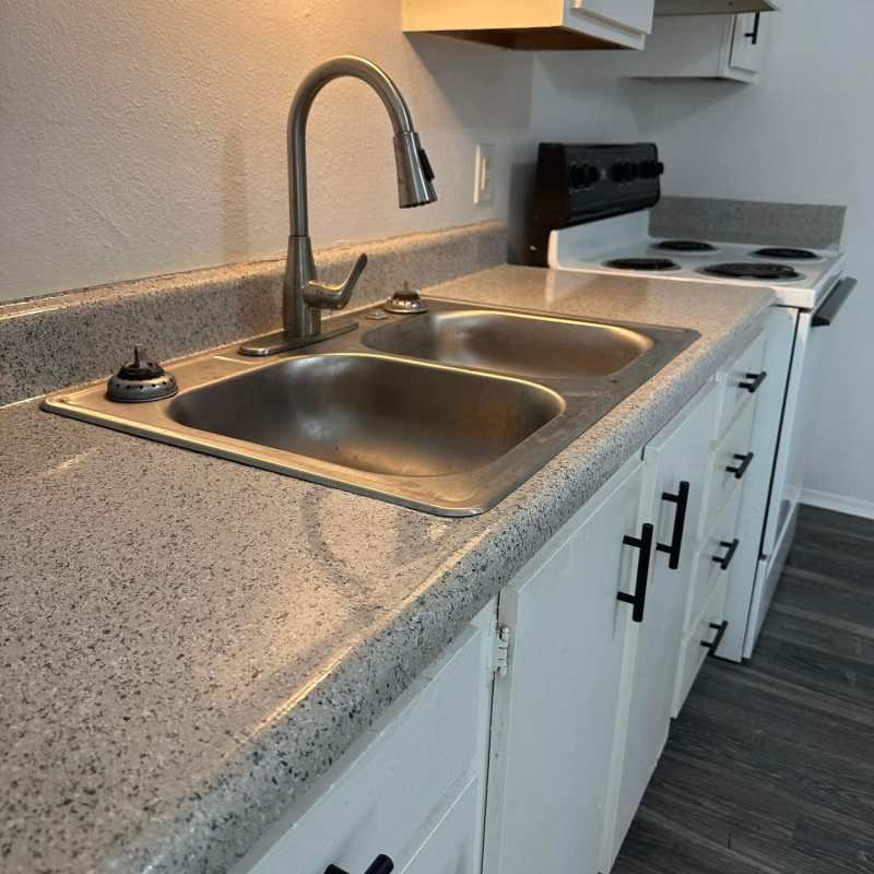 Fully equipped kitchen with granite countertops at The Residence At Okemah in Okemah, Oklahoma