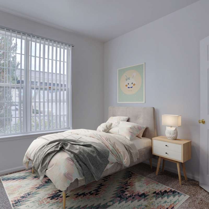 Cute child swinging on a swing at Westmeadow Peaks Apartments in Colorado Springs, Colorado