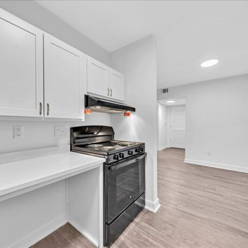 Kitchen with wooden cabinets at Canebreak Apartments in Summerville, South Carolina