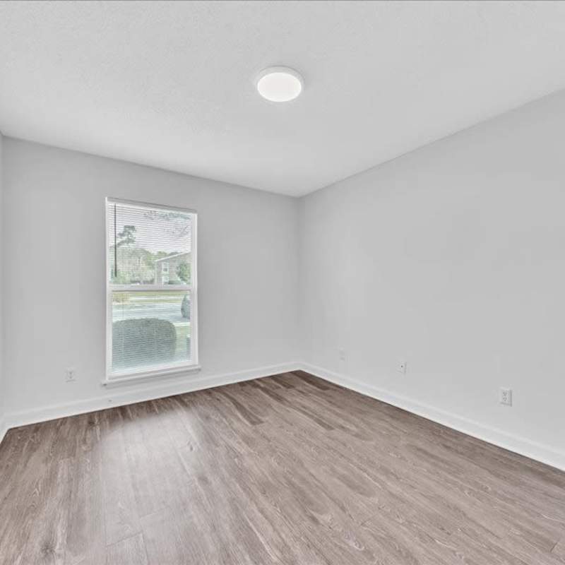 Bedroom with a window at Canebreak Apartments in Summerville, South Carolina