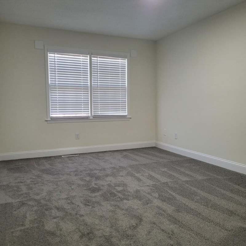 Unfurnished bedroom with window at Magnolia Downs in Charleston, South Carolina