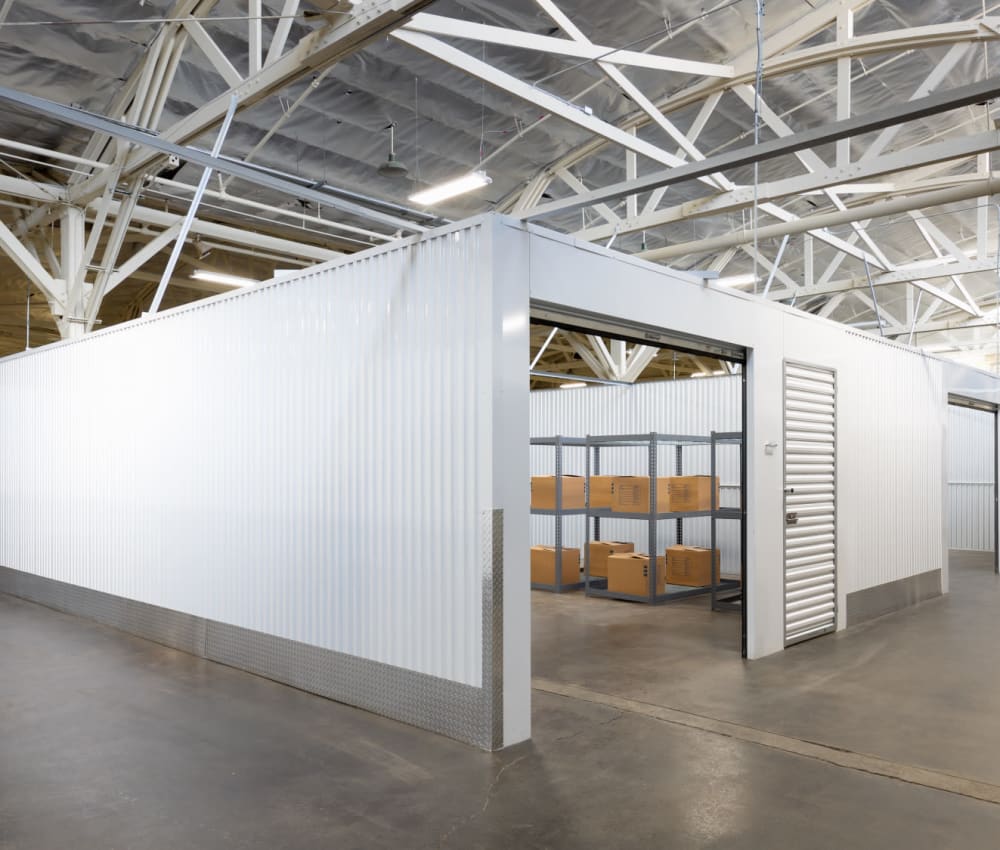 Small warehouse unit in  FlexHQ in Los Angeles, California with a racking system and packed boxes