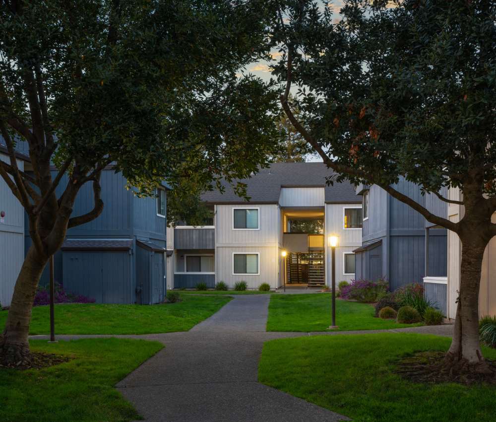 A walkway leading to a building at Park Ridge Apartment Homes in Rohnert Park, California