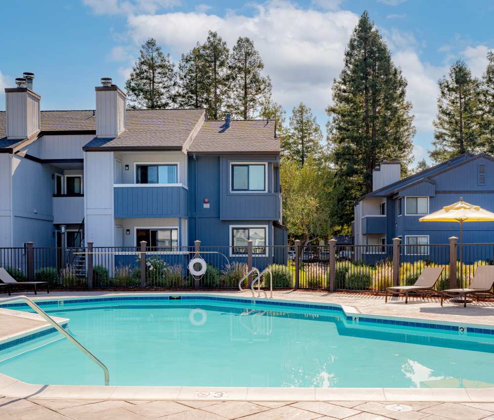A pool in front of apartment units at Park Ridge Apartment Homes in Rohnert Park, California