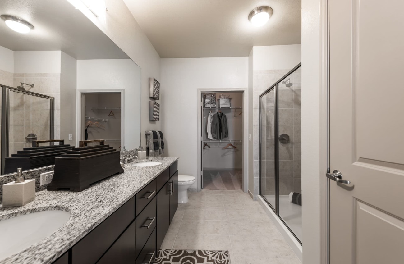 Bathroom with large mirror at Amelia Westshore in Tampa, Florida