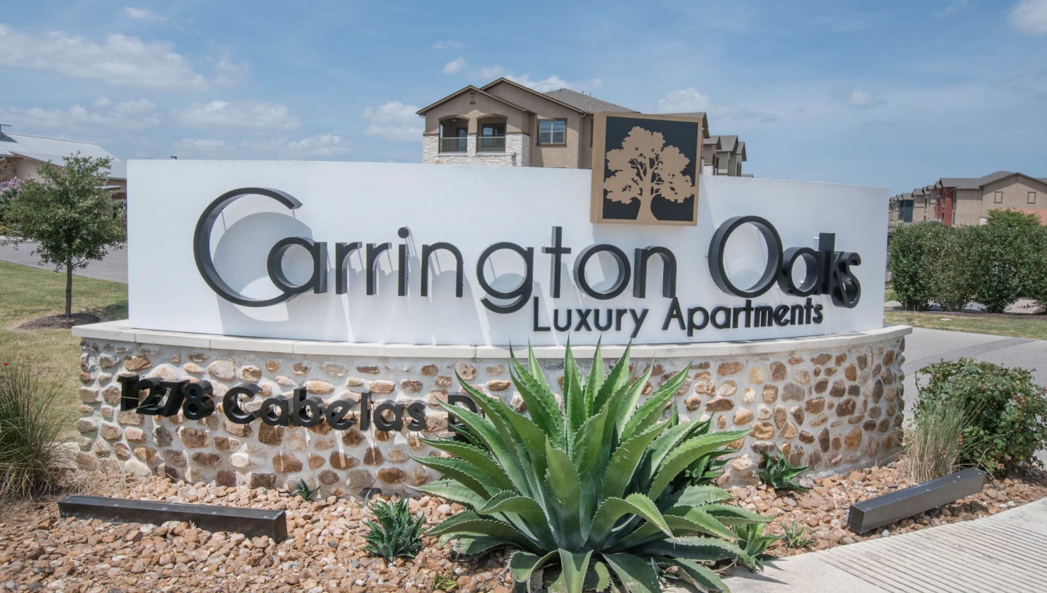 Our sign welcoming residents and their guests to Carrington Oaks in Buda, Texas