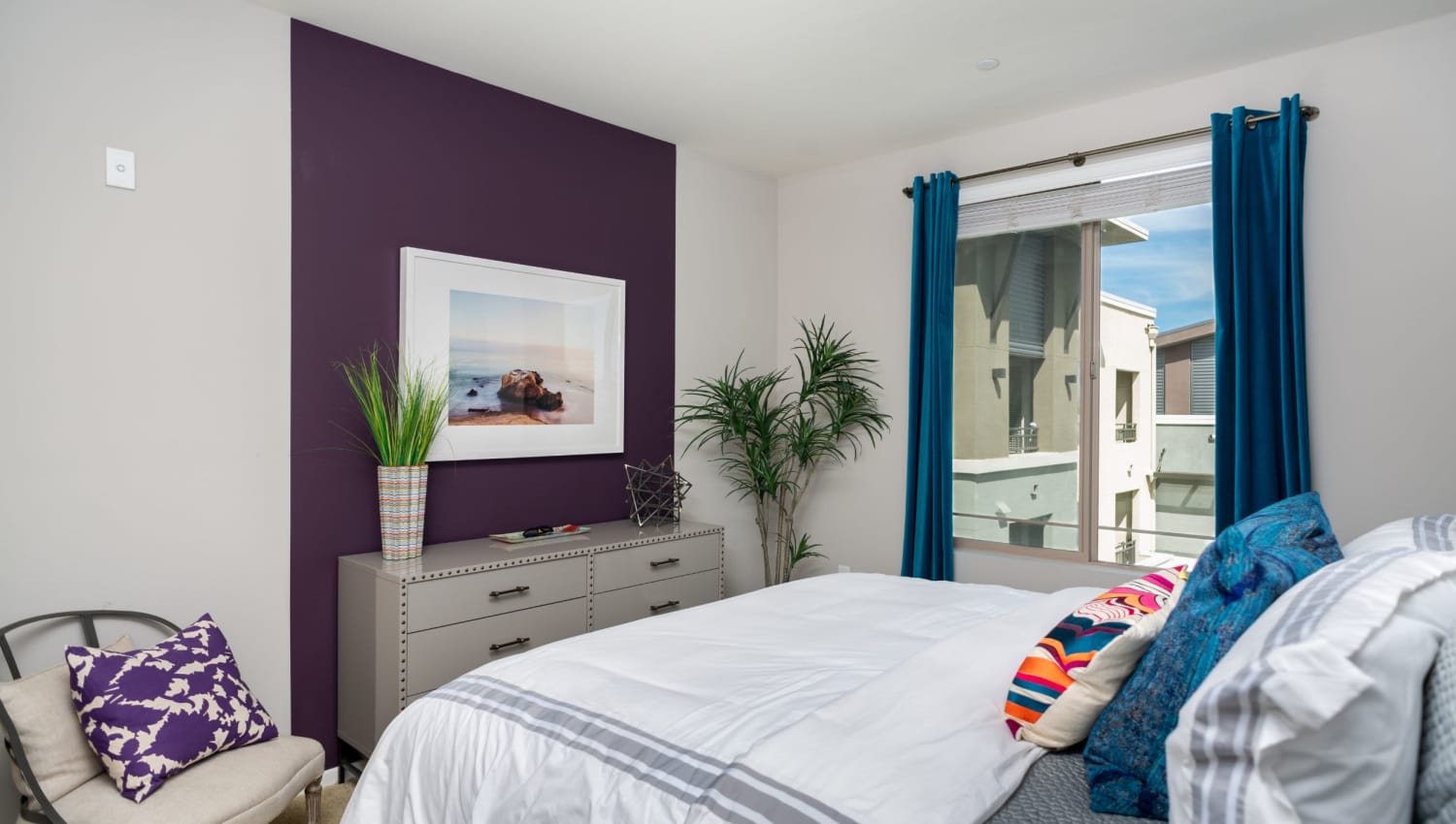 Well-lit modern bedroom at Olympus Corsair in San Diego, California
