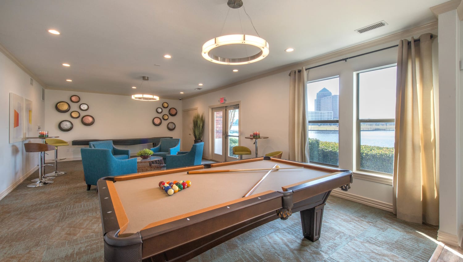 Billiards table and more in the clubhouse game room at Olympus Las Colinas in Irving, Texas