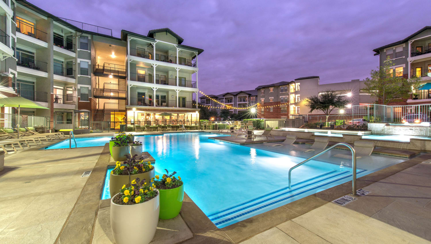 Swimming pool area in the early evening at Olympus Las Colinas in Irving, Texas