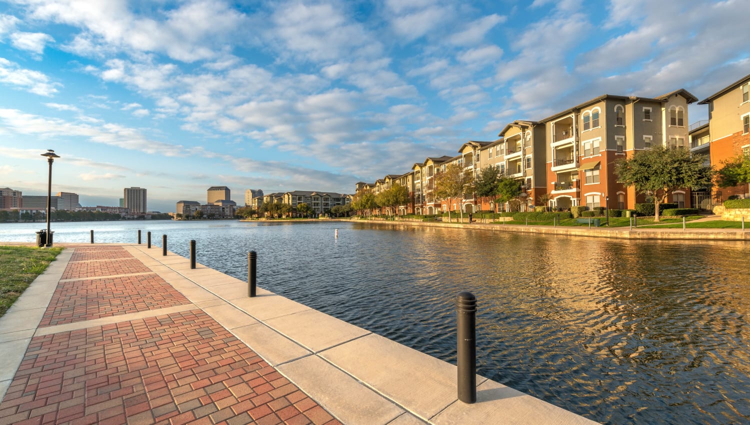 Morning view of our luxury community from across the lake near Olympus Las Colinas in Irving, Texas
