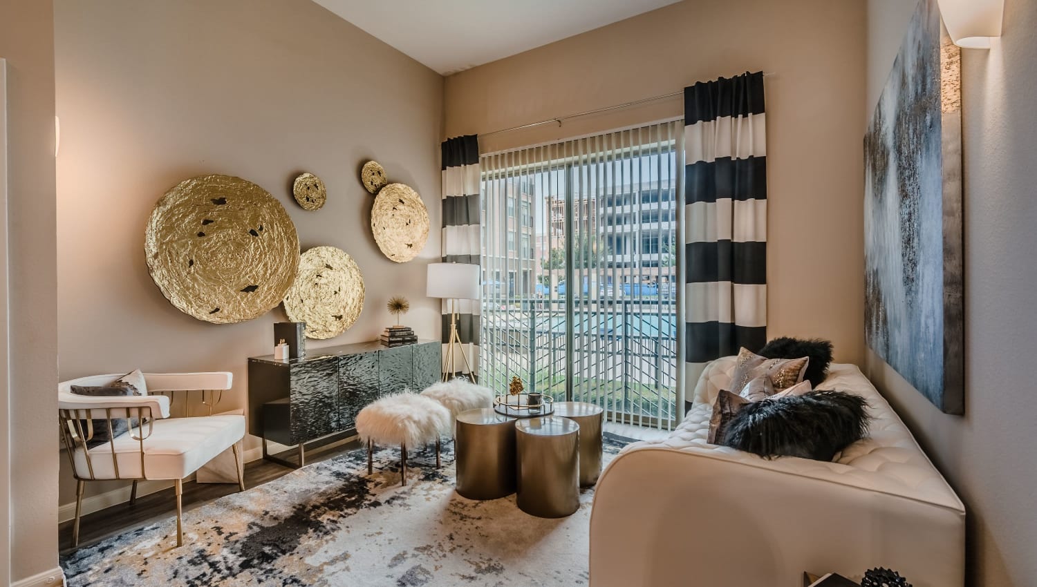 Living room with view of resort-style pool at Olympus Boulevard in Frisco, Texas