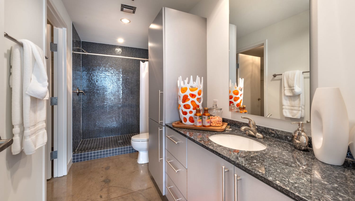 Spacious bathroom with large shower at Mosaic Dallas in Dallas, Texas