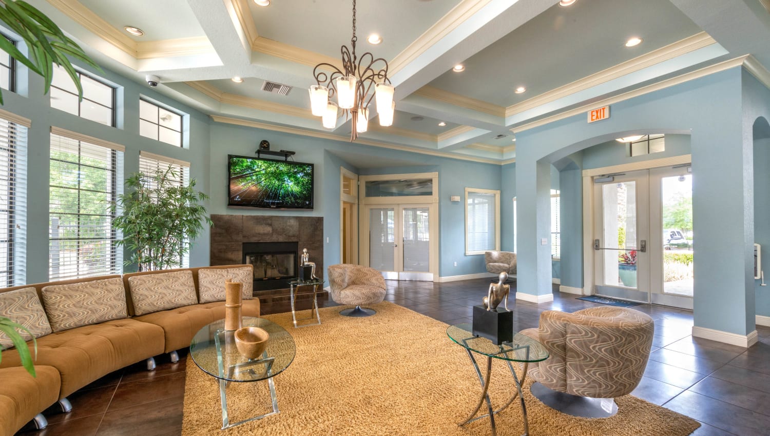Luxurious clubhouse lounge in front of the fireplace at Mirador & Stovall at River City in Jacksonville, Florida