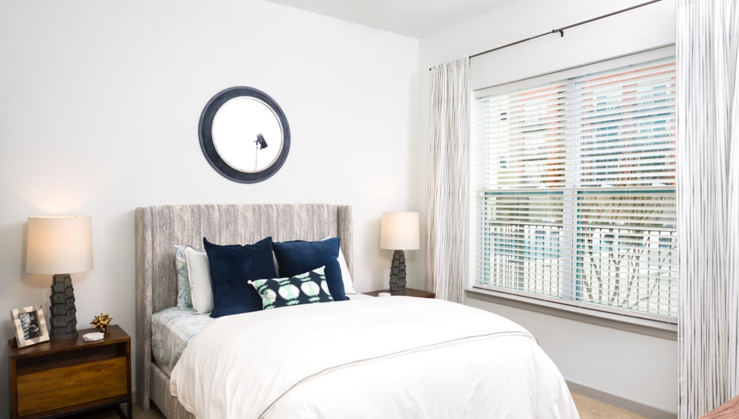 Large bay windows in a model home's bedroom at Lux on Main in Carrollton, Texas