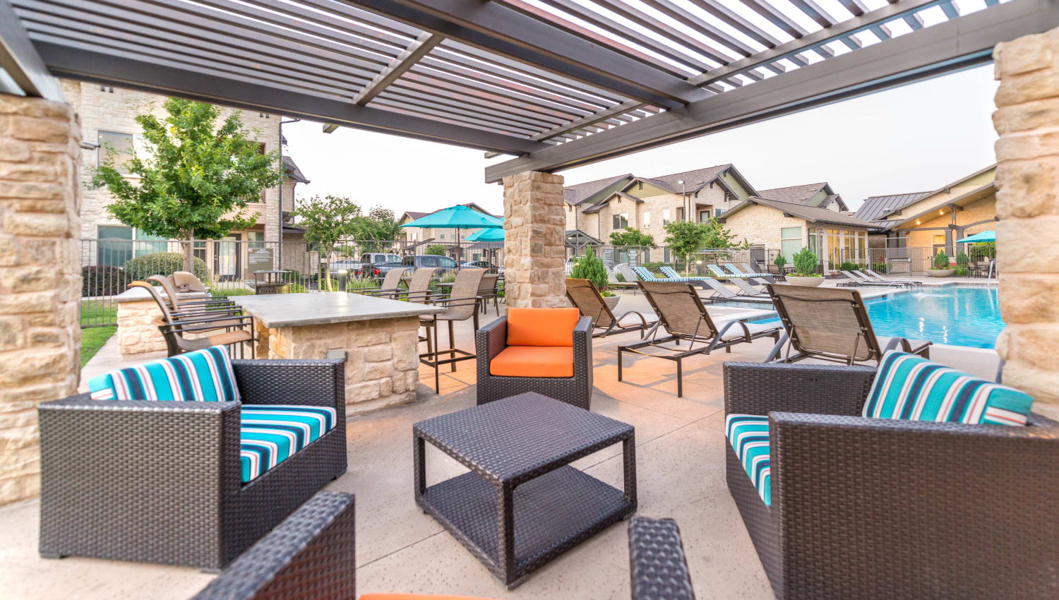 Pergola over an outdoor lounge area at Olympus Waterford in Keller, Texas