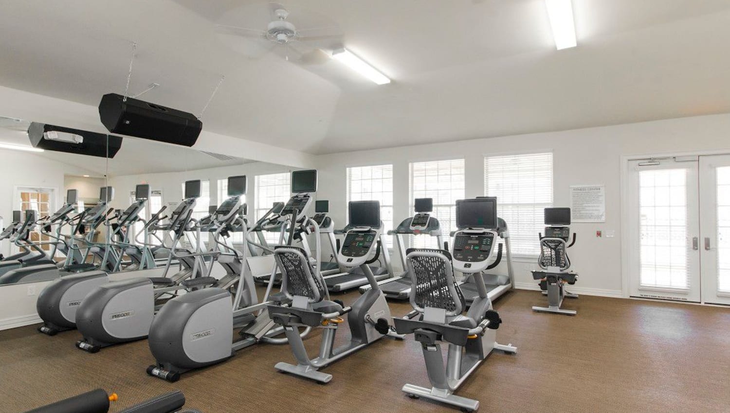 Plenty of cardio machines in the fitness center at Olympus Woodbridge in Sachse, Texas