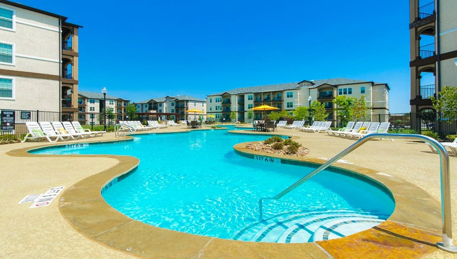 Expansive resort-style swimming pool at Olympus Woodbridge in Sachse, Texas