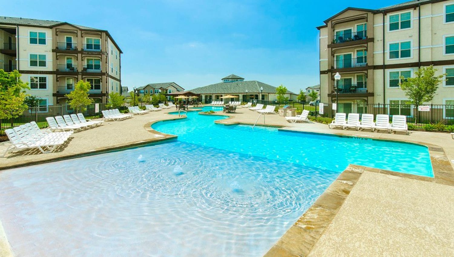 Large sun deck in the pool at Olympus Woodbridge in Sachse, Texas
