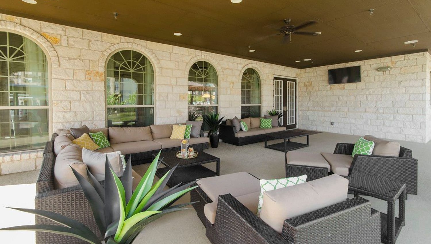 Large covered outdoor lounge at Olympus Woodbridge in Sachse, Texas