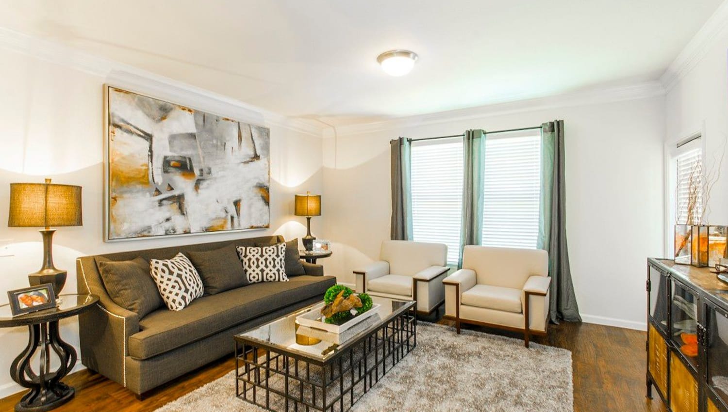 Classic decor in a model home's living area at Olympus Woodbridge in Sachse, Texas
