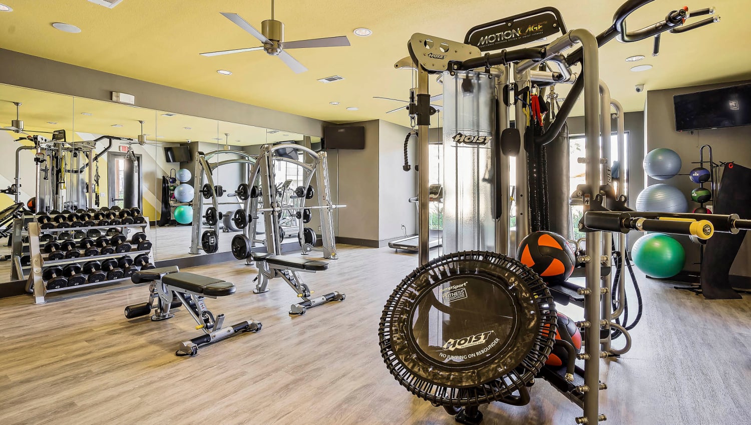 Free weights and exercise machines in the fitness center at Sundance Creek in Midland, Texas
