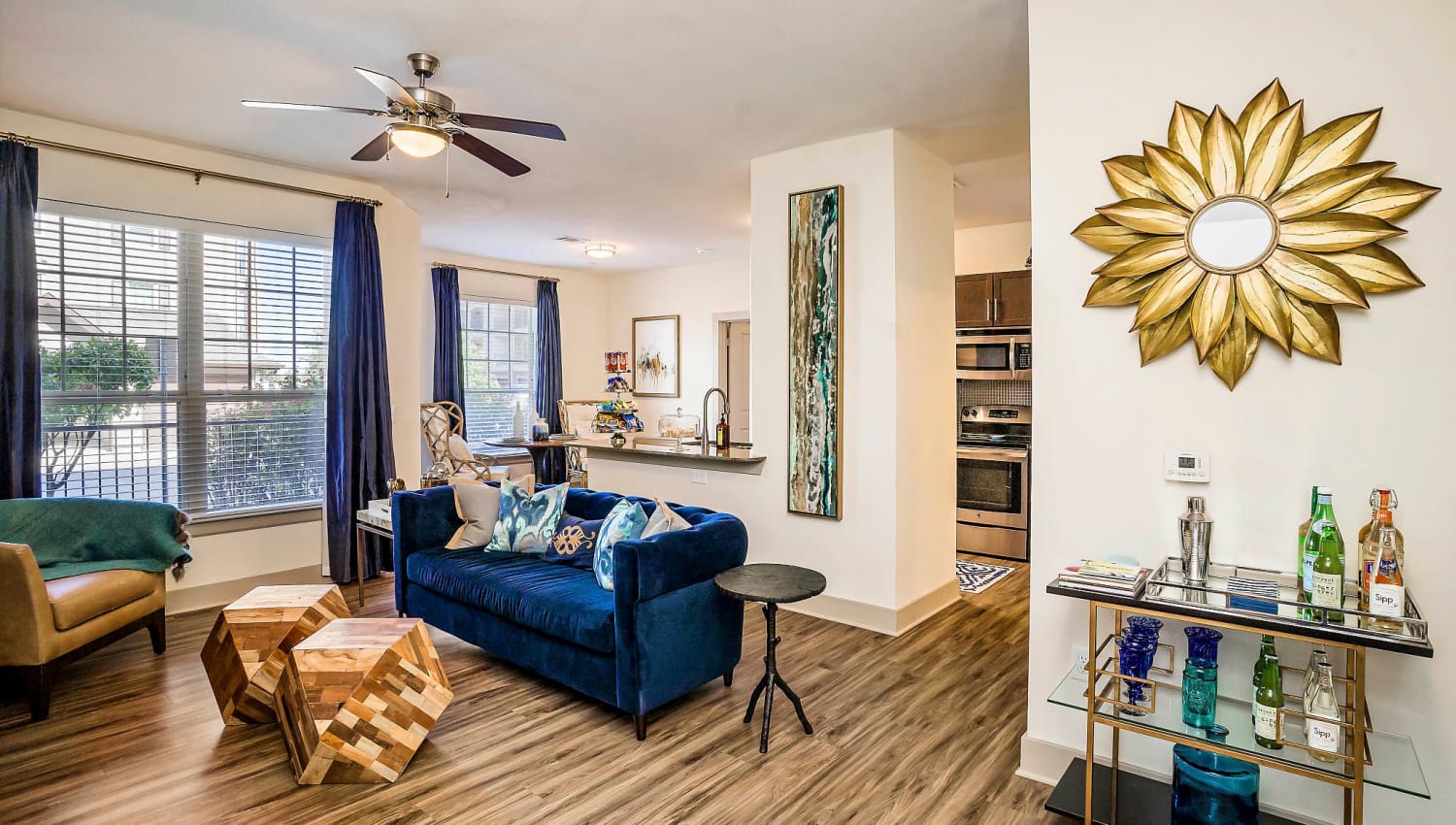 Ceiling fan and modern furnishings in a model home's living area at Sundance Creek in Midland, Texas