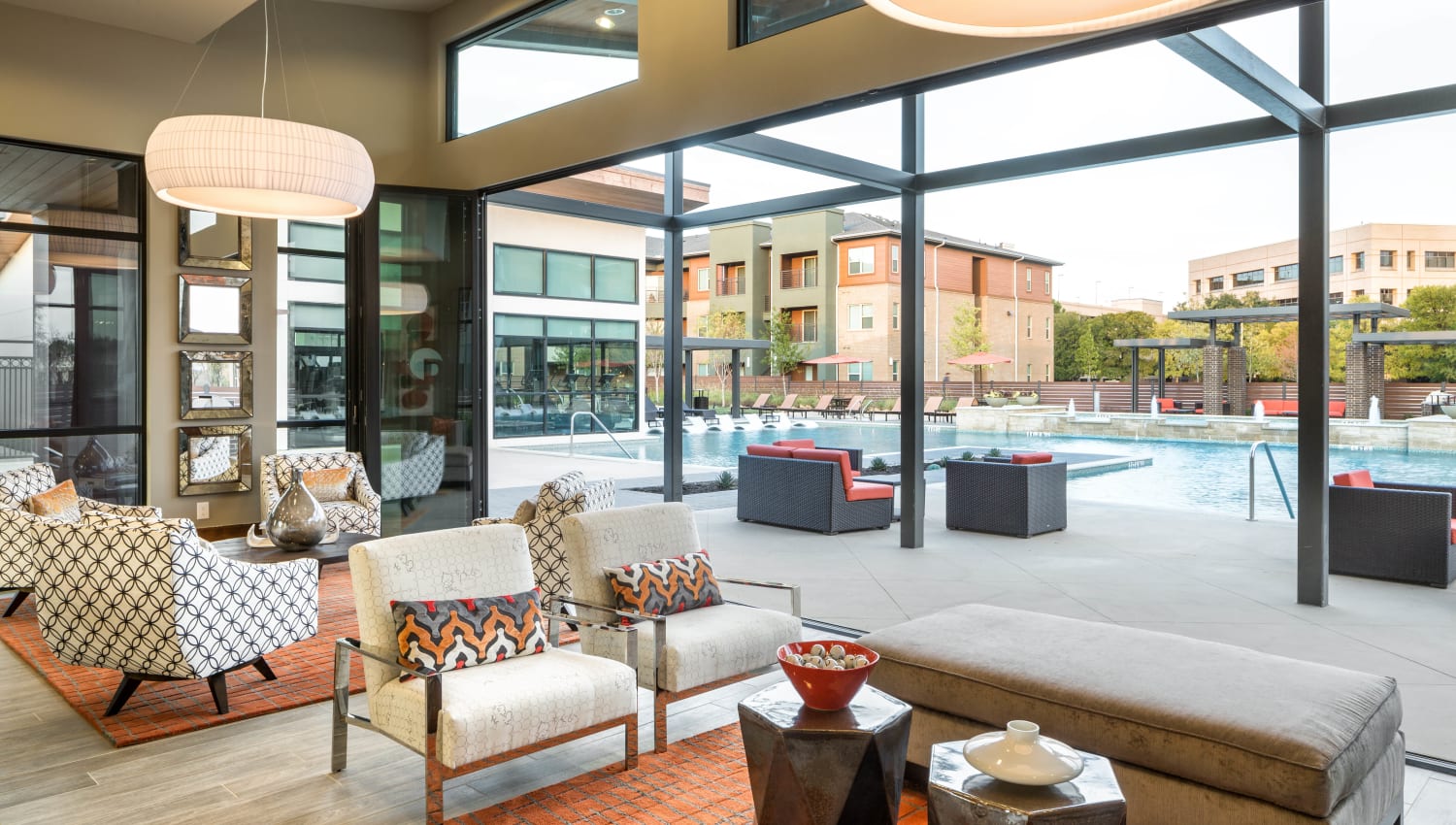 Clubhouse lounge with a view of the pool at The Davis in Fort Worth, Texas