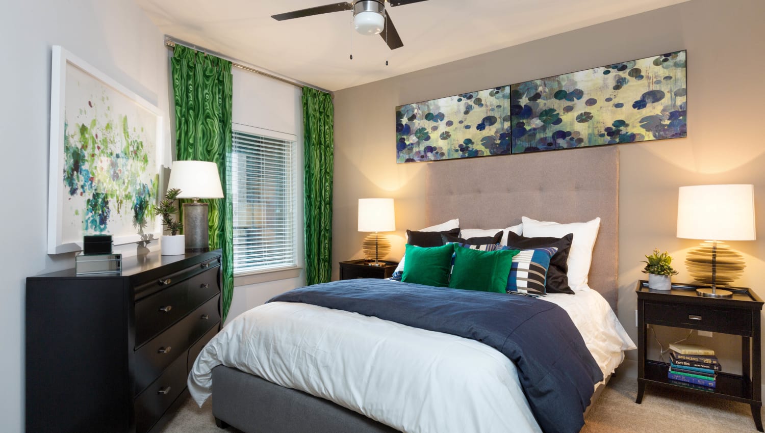 Ceiling fan and plush carpeting in a model home's bedroom at The Davis in Fort Worth, Texas