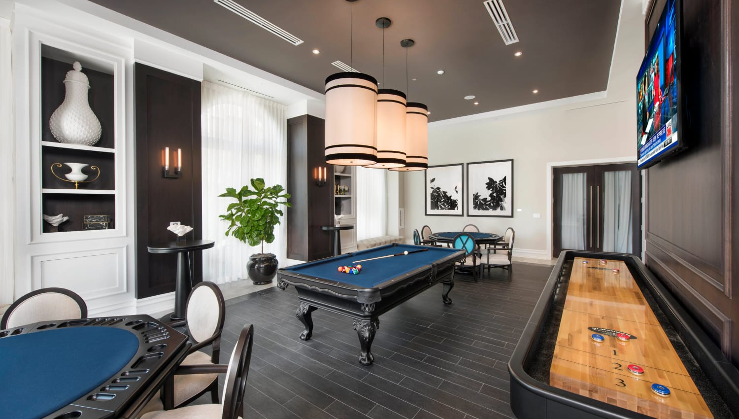 Well-appointed game room with billiards and more in the clubhouse at Olympus Harbour Island in Tampa, Florida