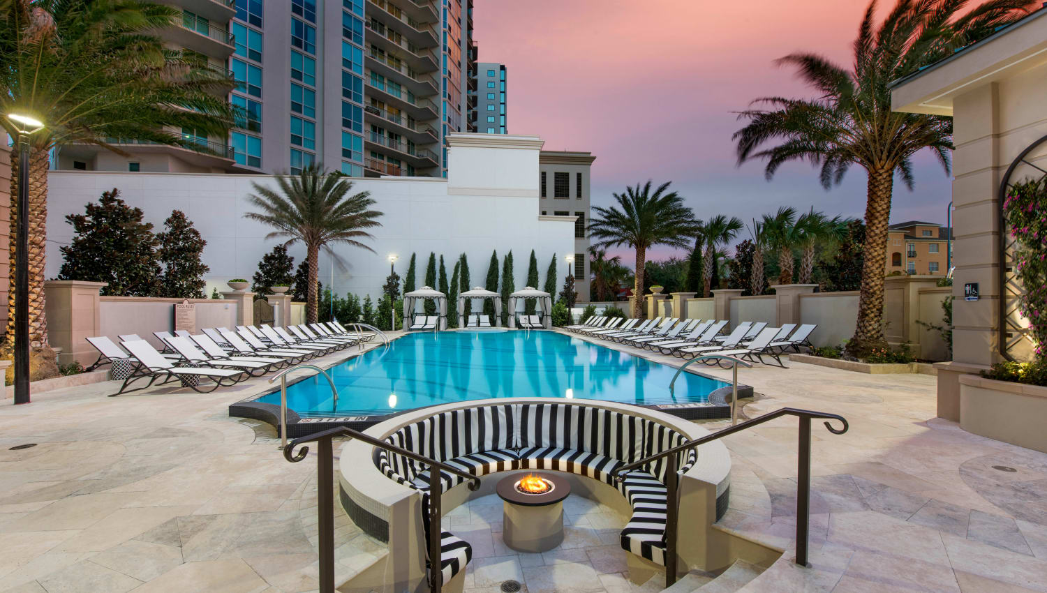 Fire pit and pool area at twilight at Olympus Harbour Island in Tampa, Floridac
