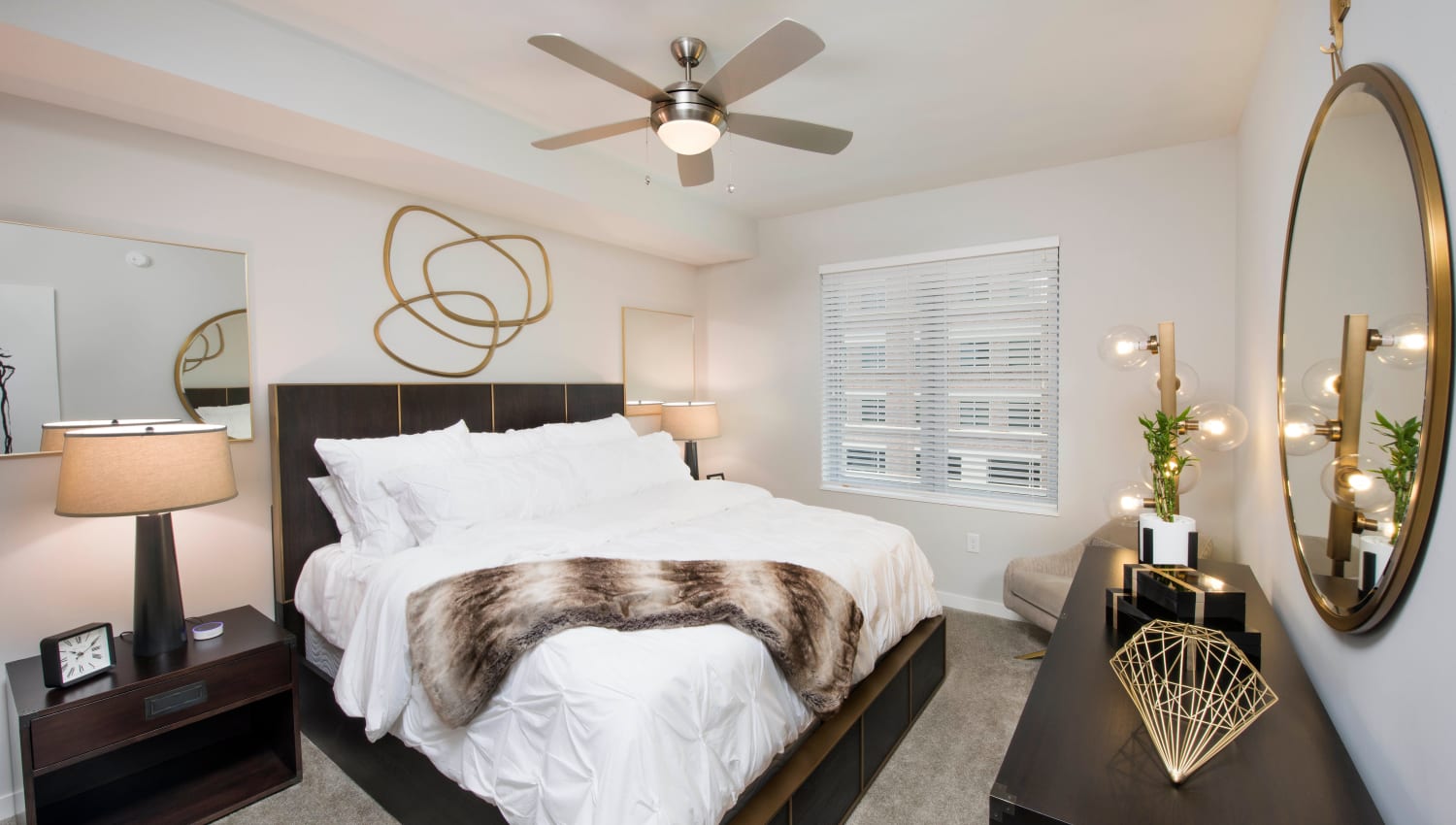 Well-furnished primary bedroom in a model home at Olympus Harbour Island in Tampa, Florida