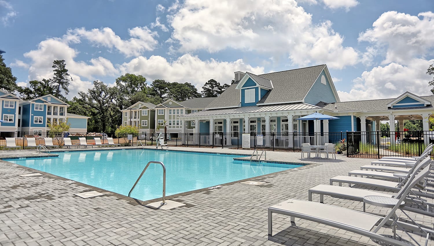 Resort-style swimming pool on a beautiful day at The Slate in Savannah, Georgia