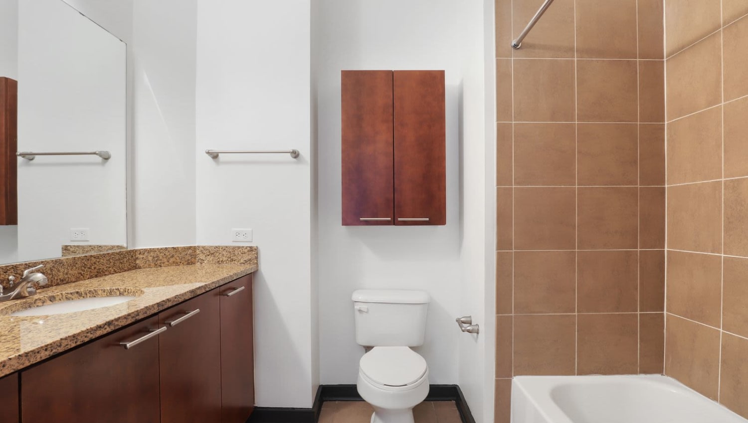 Bathroom with tile floor and tile shower/bath walls at 17th Street Lofts in Atlanta, Georgia