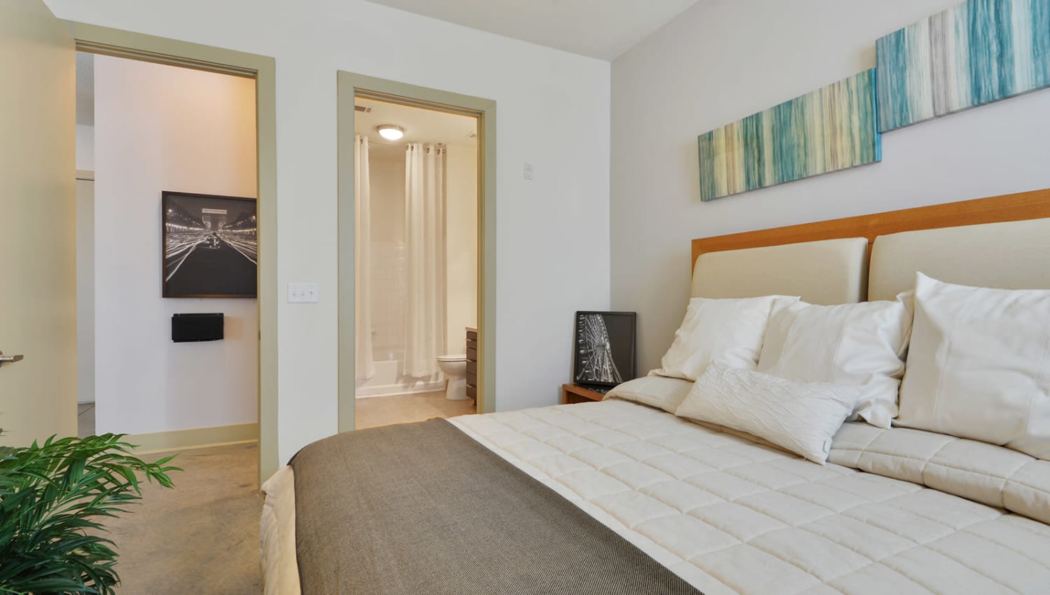 Bedroom with a walk-in closet at Optimist Lofts in Atlanta, Georgia