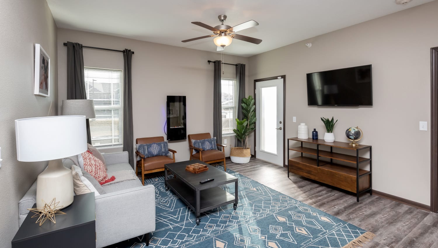Living room with wood style flooring at Autumn Ridge in Waukee, Iowa