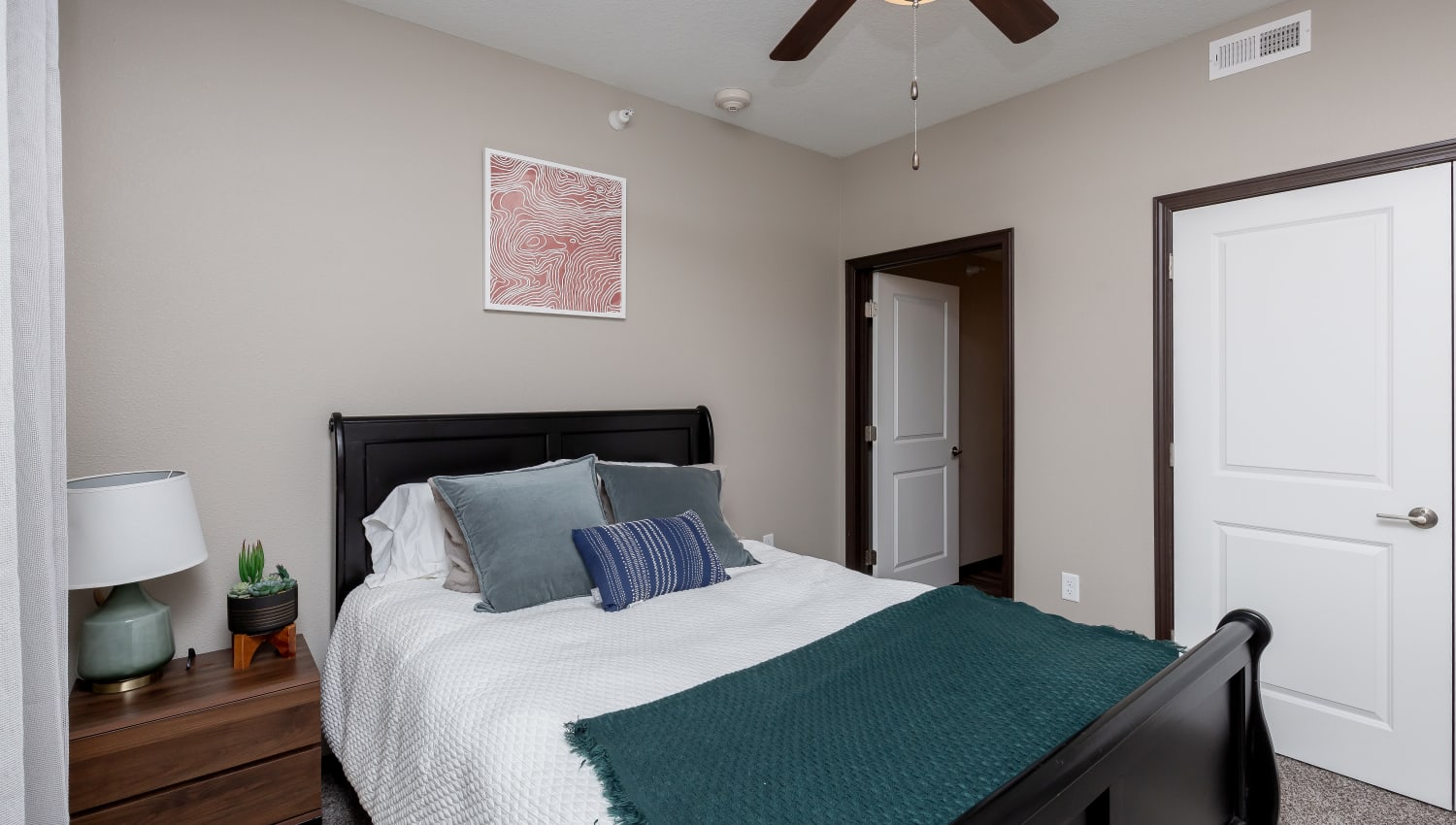 Bedroom with a ceiling fan at Autumn Ridge in Waukee, Iowa