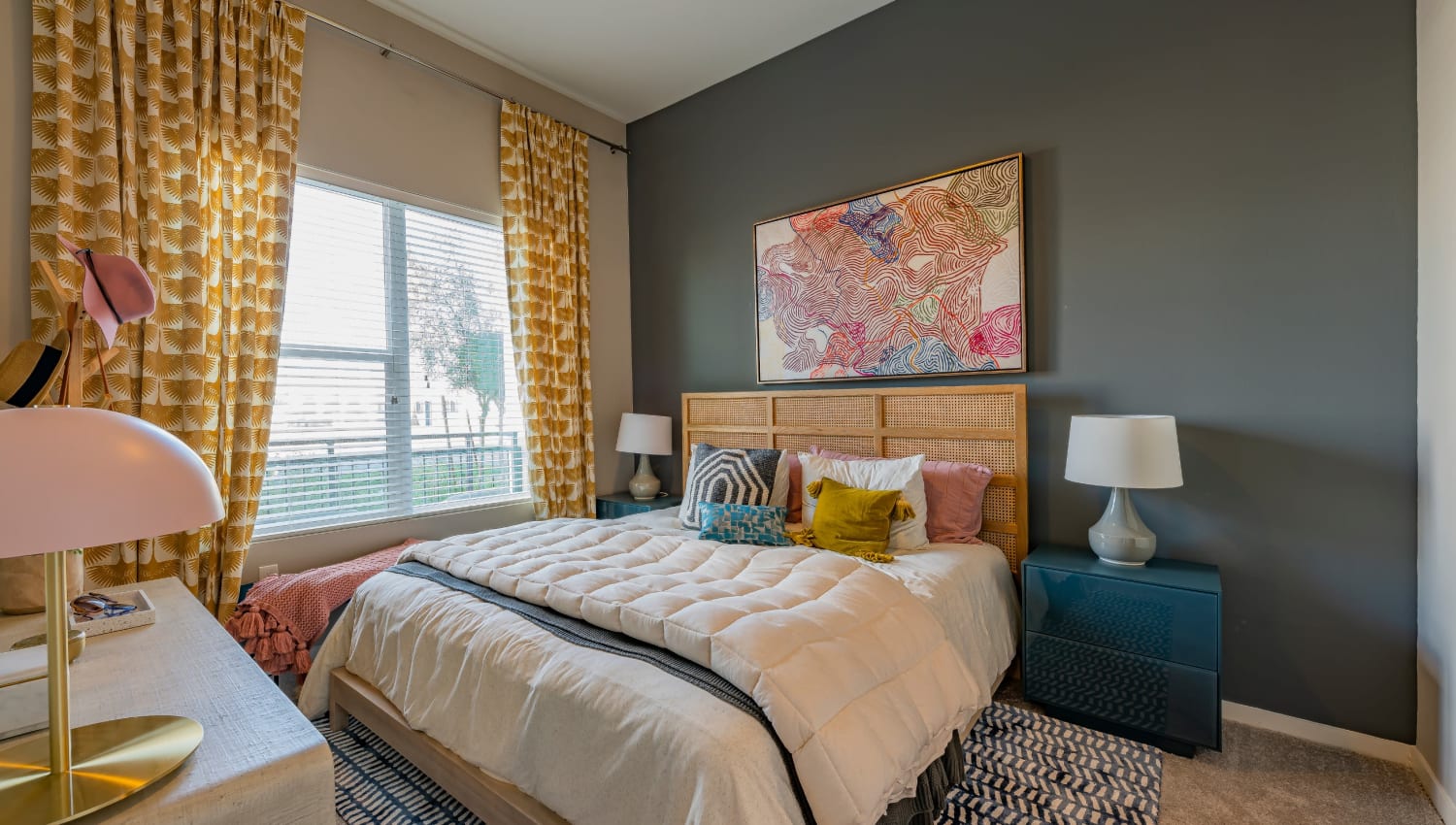 A large bedroom with plush carpeting at The Tessera in Phoenix, Arizona