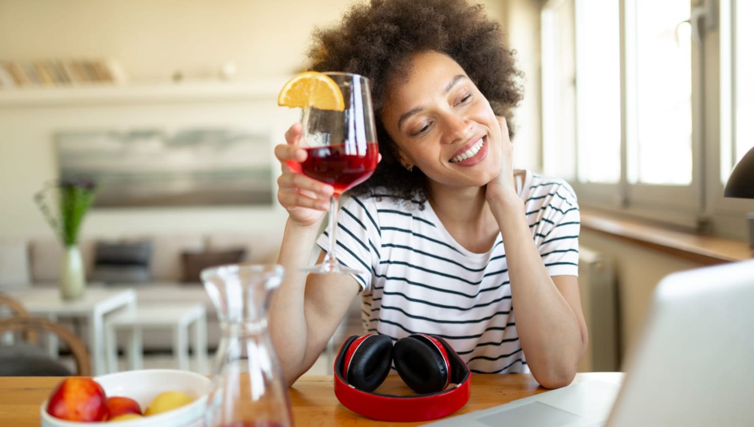 Enjoying some sangria while working on the computer at The Residences at Sawmill Station in Morton Grove, Illinois