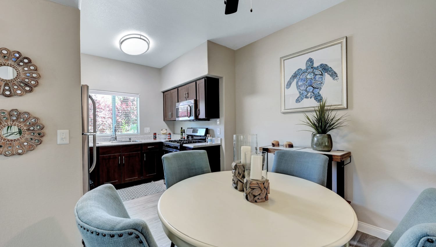 Model kitchen and dining area at Canyon Villas Apartments in Las Vegas, Nevada